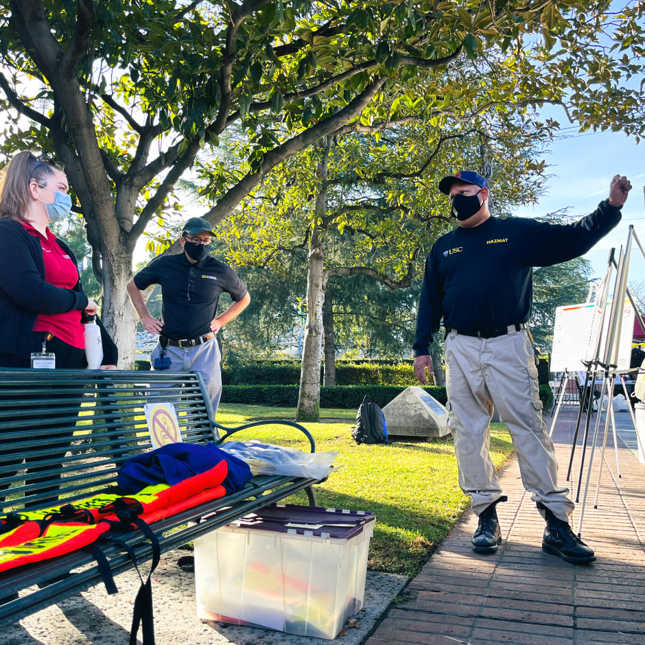 USC Environmental Health & Safety worker instructing emergency workshop outside on campus