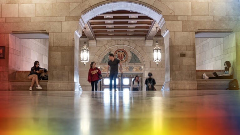 Students in building walking up the stairs