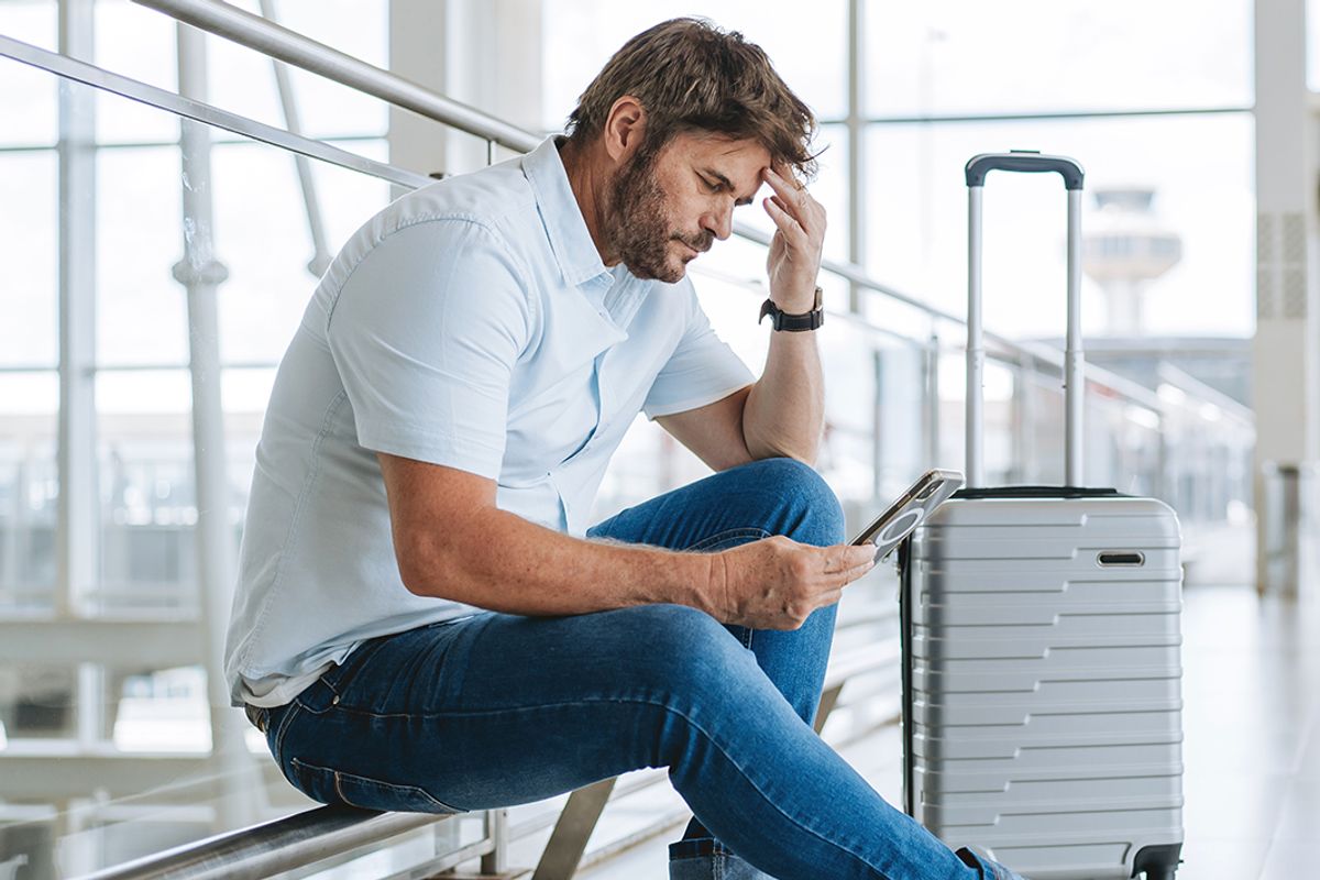 A man checks at an airport