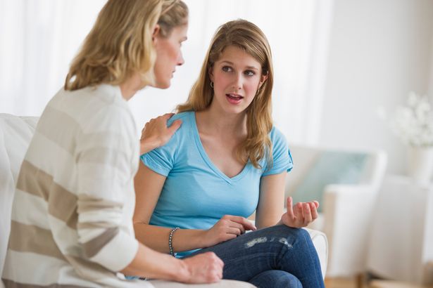 Mum talking to her daughter