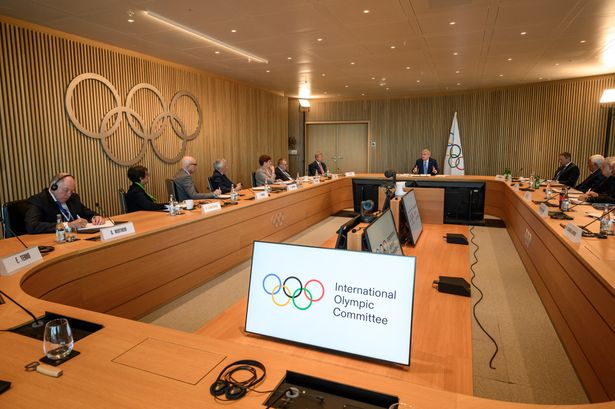 International Olympic Committee (IOC) president Thomas Bach (C) speaks during an IOC executive board meeting where the issue of Russian athletes will be discussed, in Lausanne, on March 28, 2023. Poland, Ukraine and the Baltic states reiterated on March 27, 2023 their call to maintain the ban on Russian and Belarusian athletes at the Olympics, saying "not a single reason" existed to lift the restrictions. (Photo by Fabrice COFFRINI / AFP) (Photo by FABRICE COFFRINI/AFP via Getty Images)