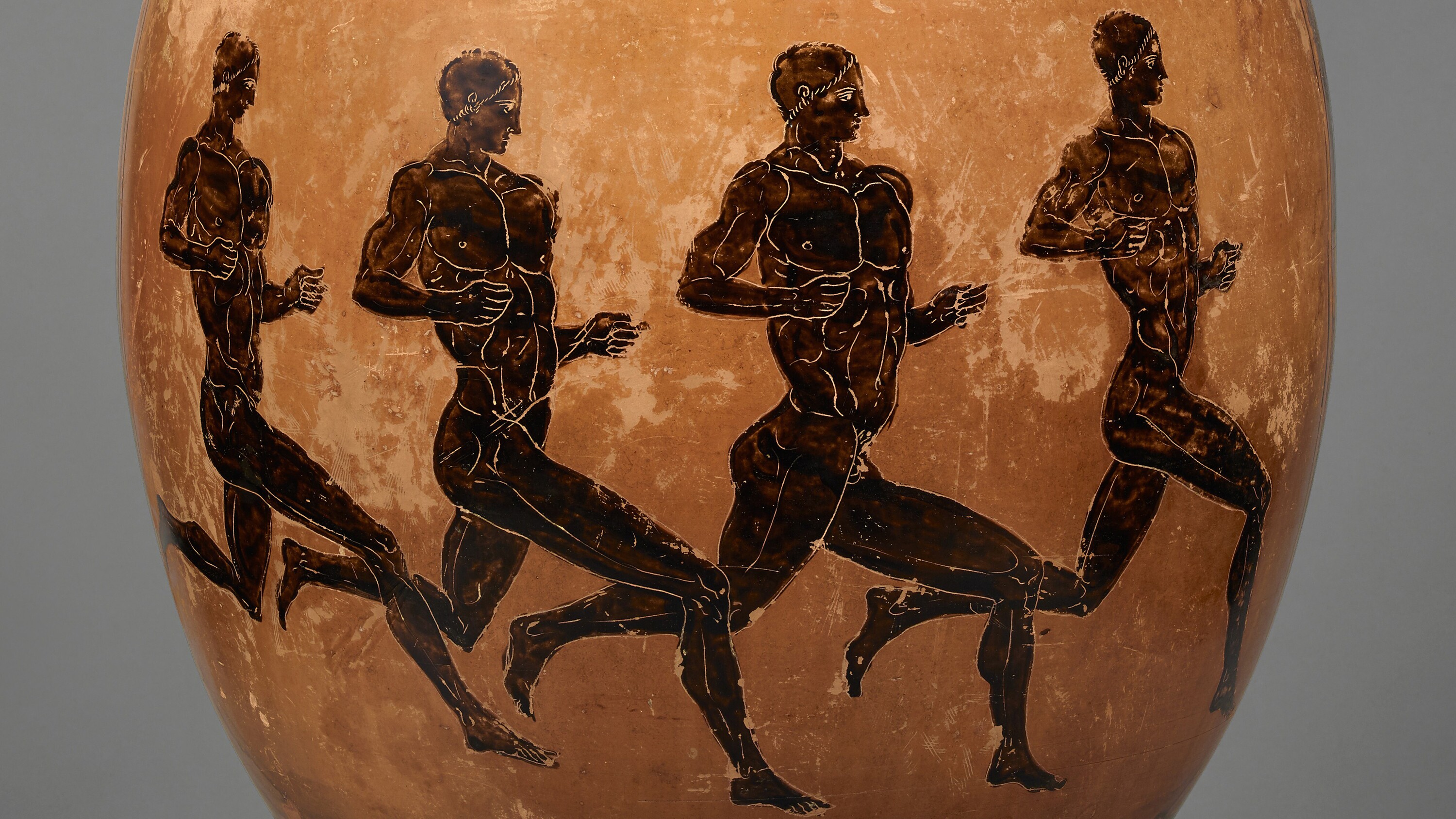Greek, ceramic jar featuring images four nude, muscular men running.